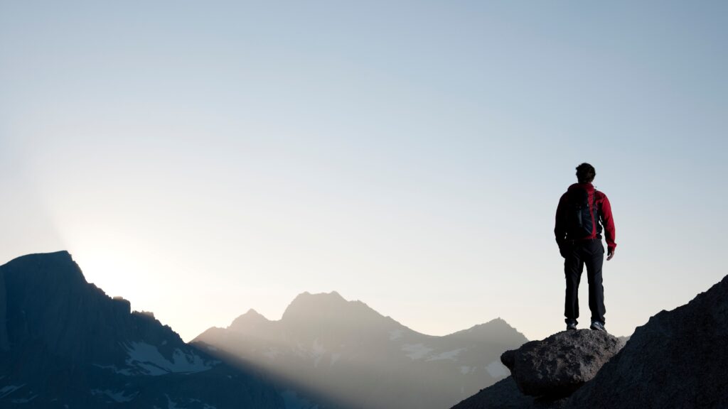 Man looking at mountains